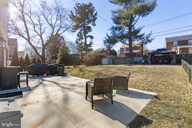 view of patio with a gazebo and fence