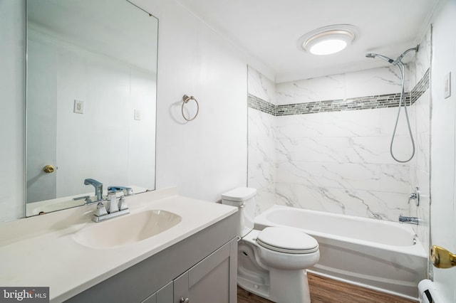 full bathroom with toilet, wood finished floors, baseboard heating, vanity, and shower / washtub combination