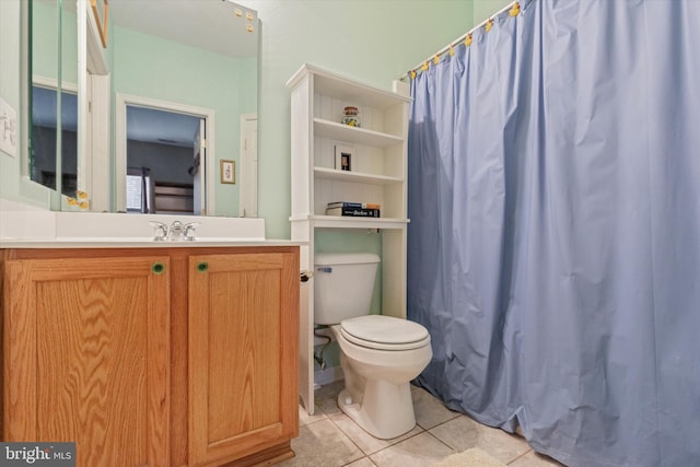 full bath featuring tile patterned flooring, a shower with shower curtain, vanity, and toilet