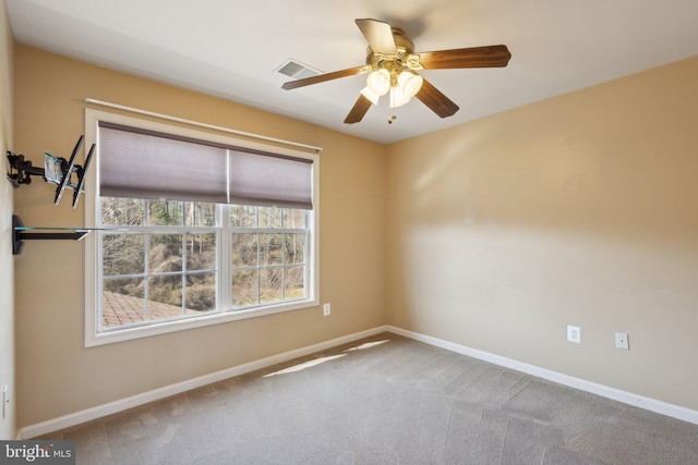 empty room featuring visible vents, ceiling fan, baseboards, and carpet floors