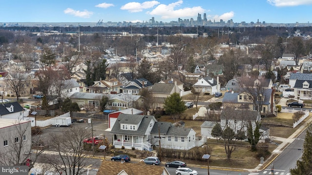 drone / aerial view featuring a residential view and a city view