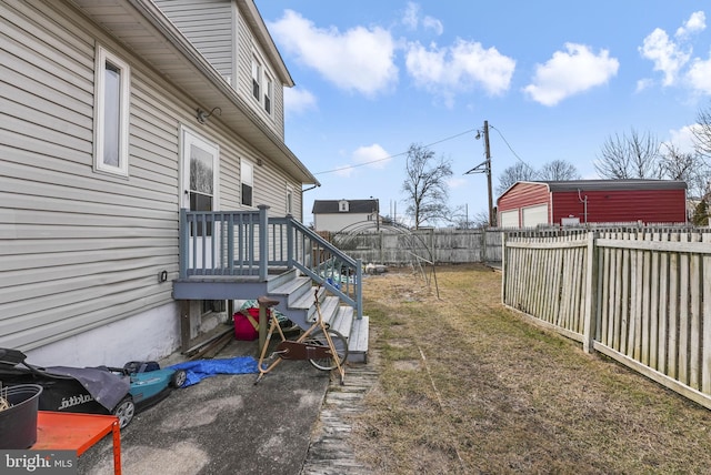 view of yard featuring an outbuilding and a fenced backyard