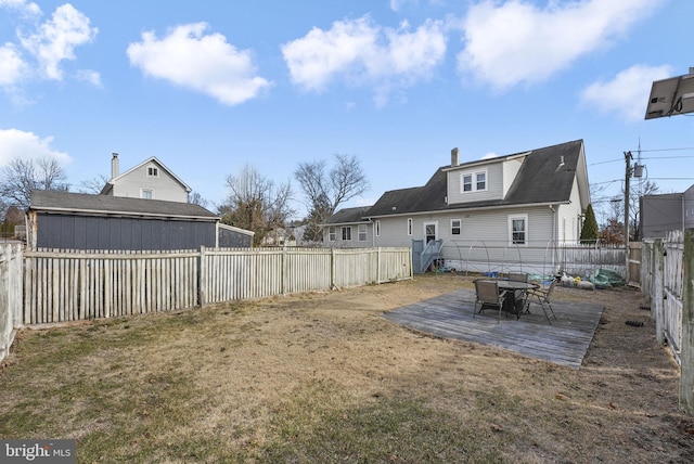 view of yard featuring a fenced backyard and a wooden deck