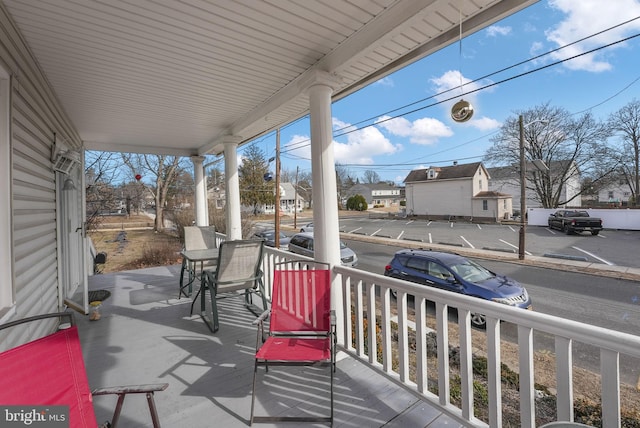 balcony with a residential view and a porch