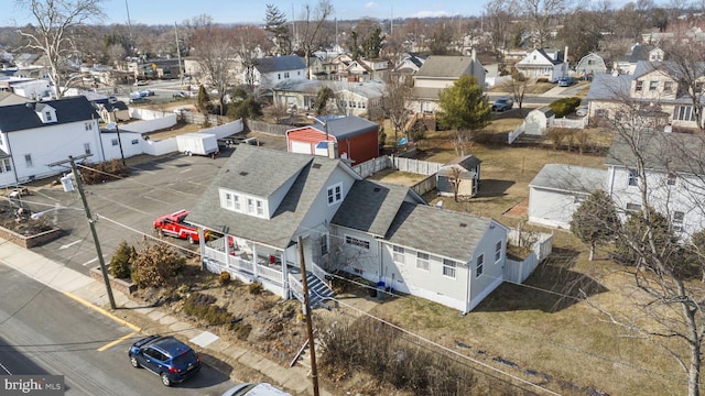 birds eye view of property with a residential view