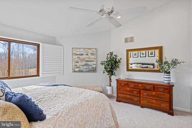 carpeted bedroom with vaulted ceiling, a ceiling fan, visible vents, and baseboards