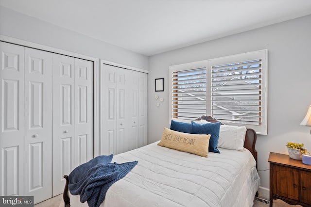 bedroom with multiple closets