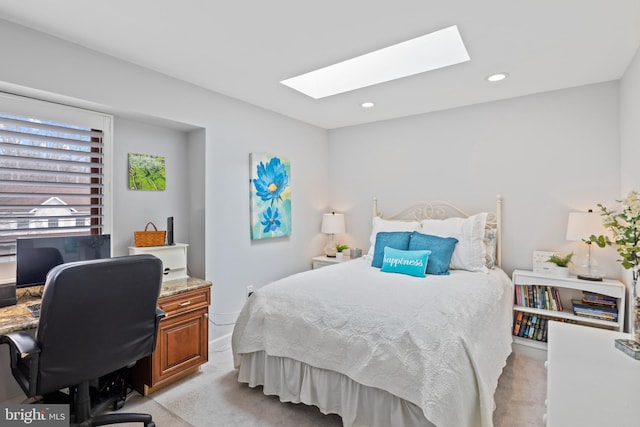 bedroom with a skylight, recessed lighting, and light colored carpet