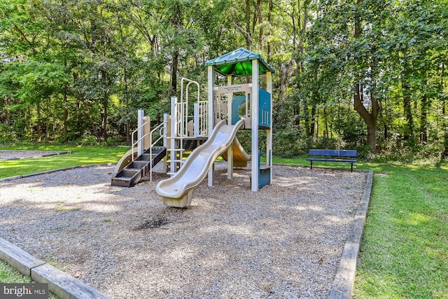 communal playground featuring a yard