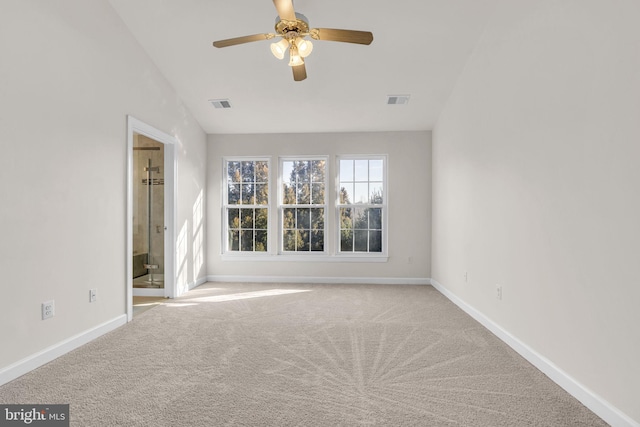 unfurnished room featuring light carpet, ceiling fan, visible vents, and baseboards