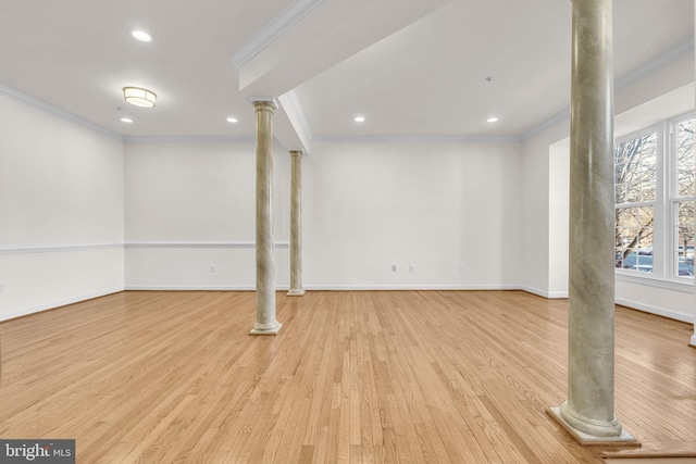 basement with light wood-style floors, baseboards, ornamental molding, and recessed lighting