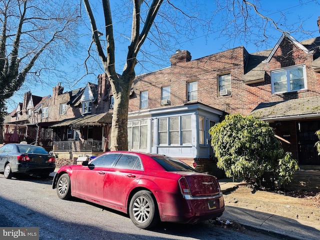 view of front of house featuring brick siding