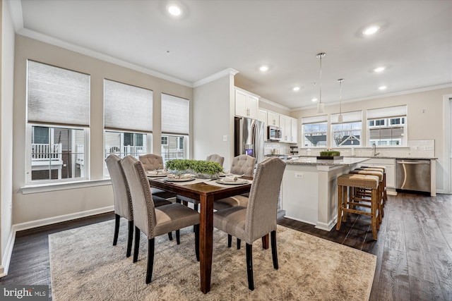 dining area with ornamental molding, dark wood-type flooring, recessed lighting, and baseboards