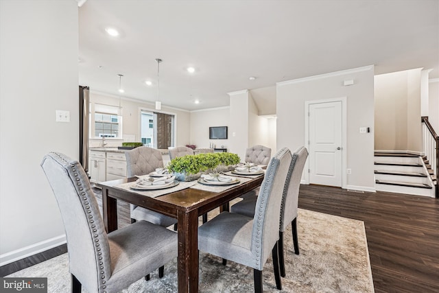 dining space with recessed lighting, wood finished floors, baseboards, stairs, and ornamental molding