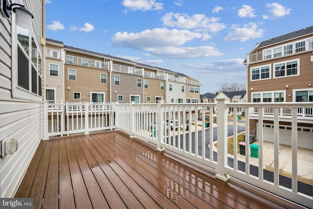 wooden deck featuring a residential view