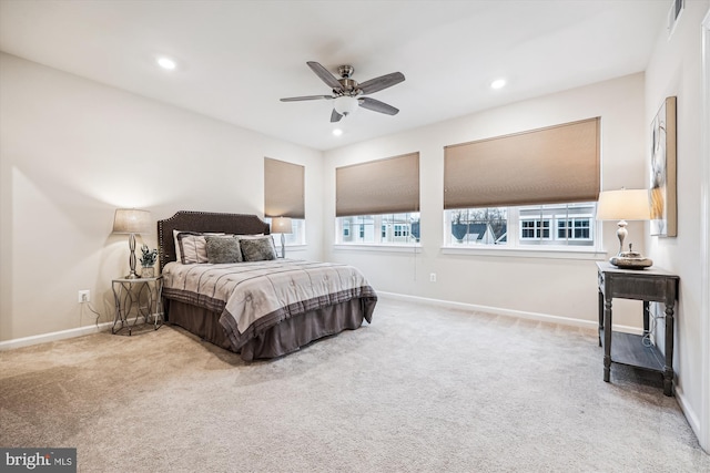 carpeted bedroom featuring visible vents, baseboards, a ceiling fan, and recessed lighting