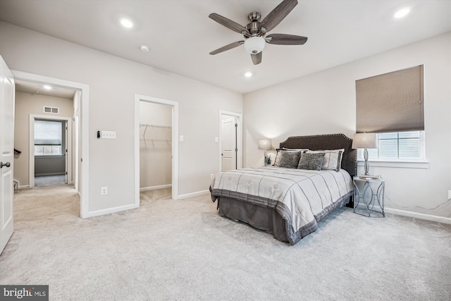 bedroom featuring light carpet, baseboards, visible vents, and recessed lighting