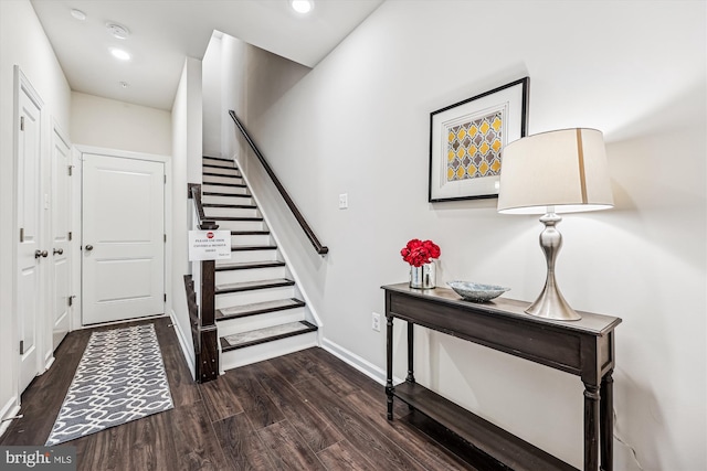 foyer entrance with recessed lighting, stairway, baseboards, and wood finished floors