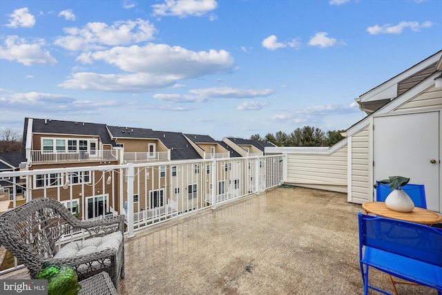 view of patio featuring a balcony