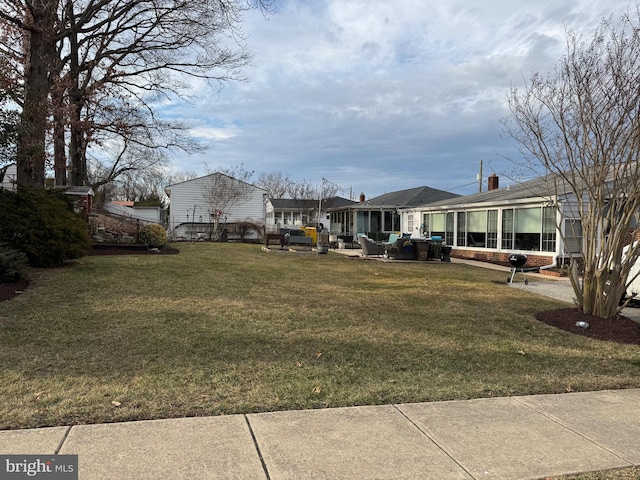 view of yard featuring a sunroom