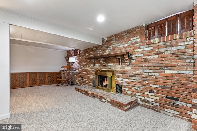 unfurnished living room featuring beamed ceiling, carpet flooring, and a fireplace