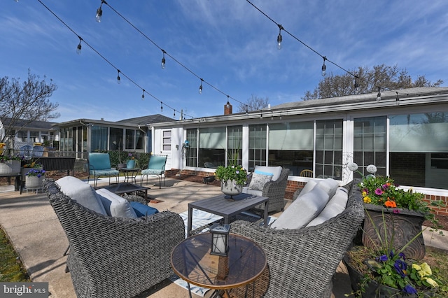 view of patio / terrace with an outdoor hangout area and a sunroom