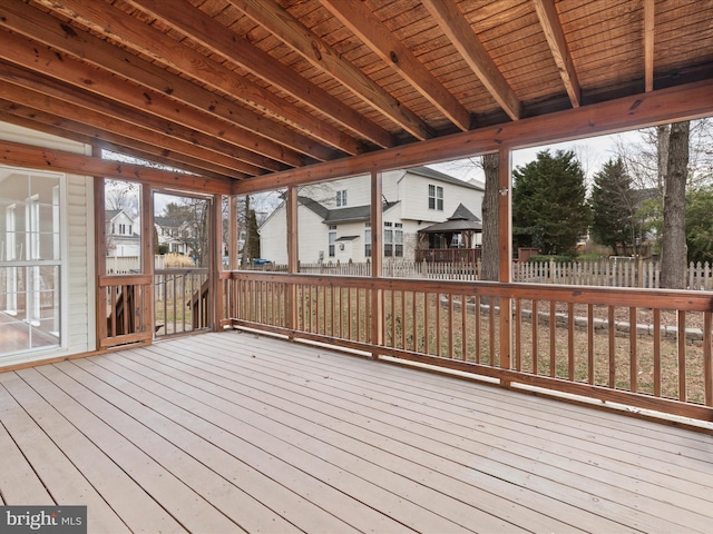 wooden deck featuring a residential view and fence