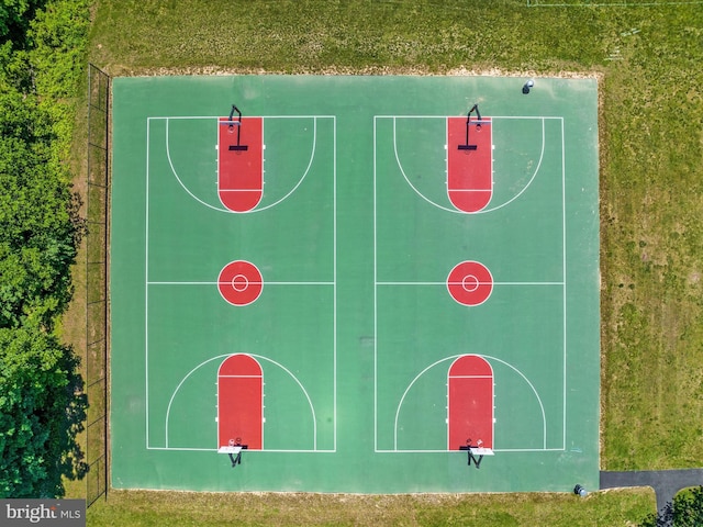 view of sport court featuring community basketball court and fence