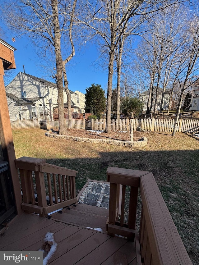 wooden terrace with fence and a yard