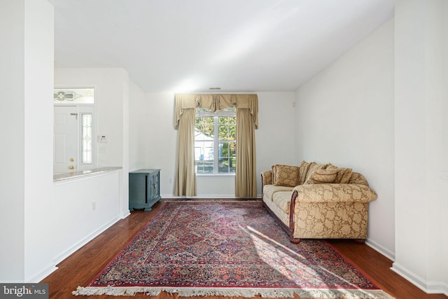 sitting room featuring dark wood-style floors and baseboards