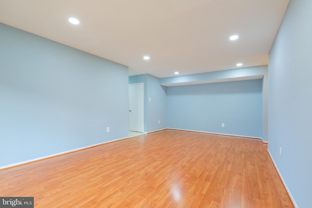 interior space with light wood-style floors, baseboards, and recessed lighting