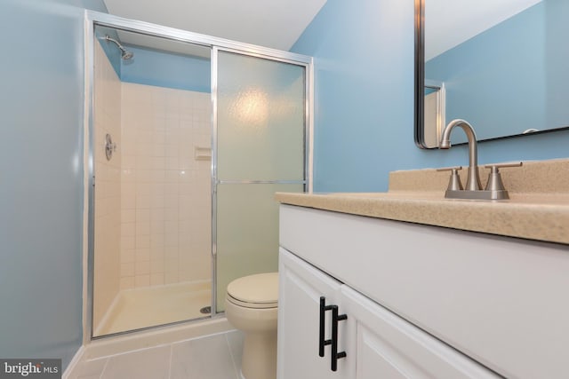 full bathroom with vanity, tile patterned flooring, a shower stall, and toilet