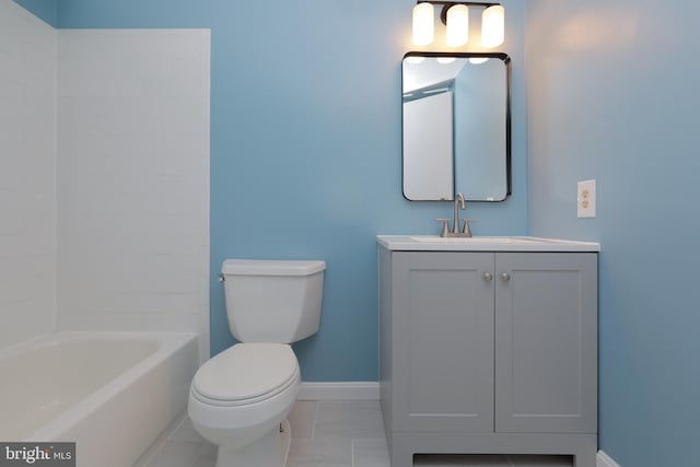 full bath featuring baseboards, toilet, shower / tub combination, marble finish floor, and vanity