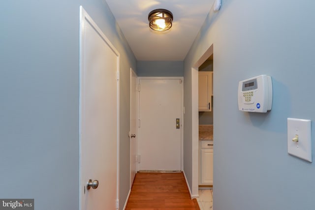 hallway featuring light wood-type flooring