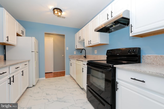 kitchen with white appliances, white cabinets, marble finish floor, light countertops, and under cabinet range hood