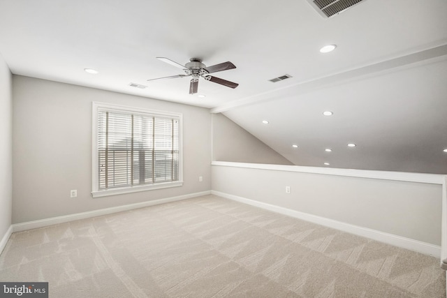 bonus room featuring baseboards, visible vents, and light colored carpet