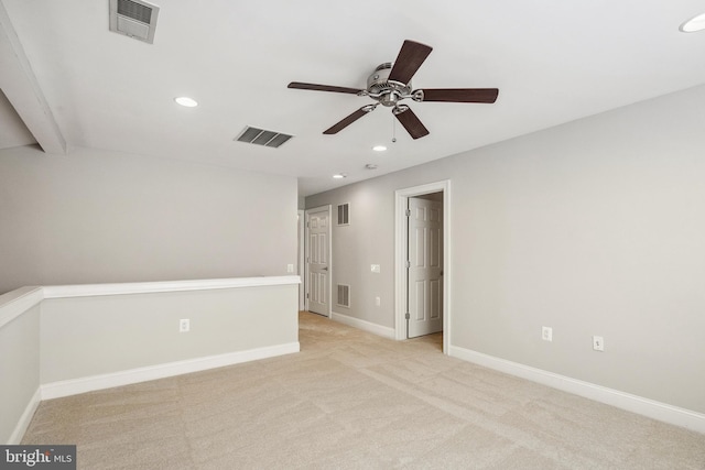 spare room featuring visible vents and baseboards