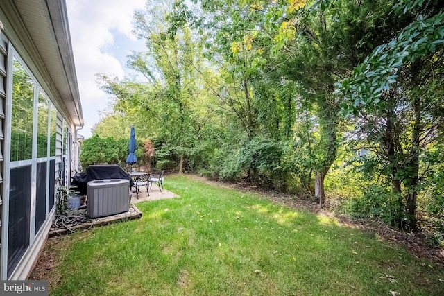 view of yard with a patio area and cooling unit