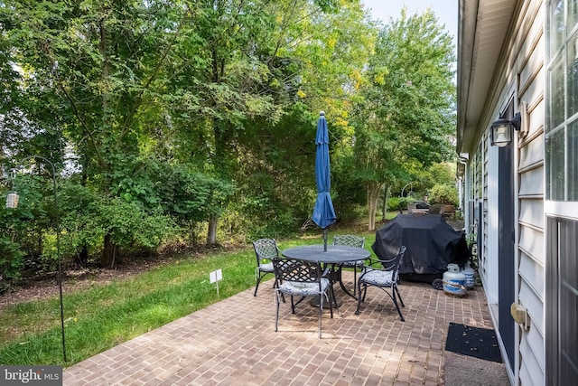 view of patio featuring grilling area and outdoor dining space