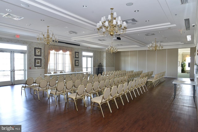 dining space featuring a decorative wall, visible vents, ornamental molding, french doors, and an inviting chandelier