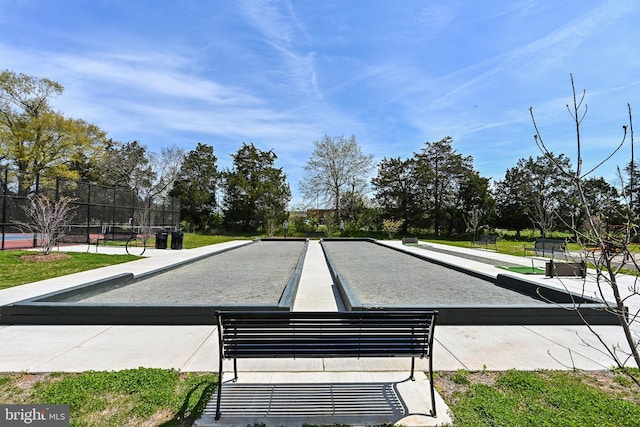 view of property's community featuring fence