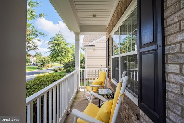 balcony featuring a porch