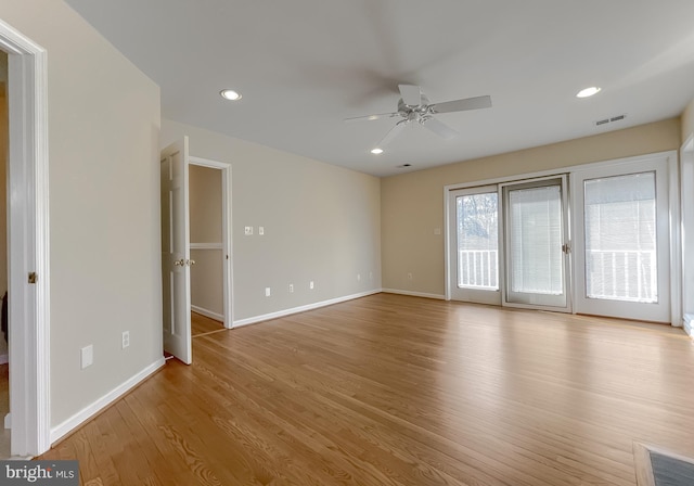 interior space featuring recessed lighting, a ceiling fan, baseboards, visible vents, and light wood finished floors