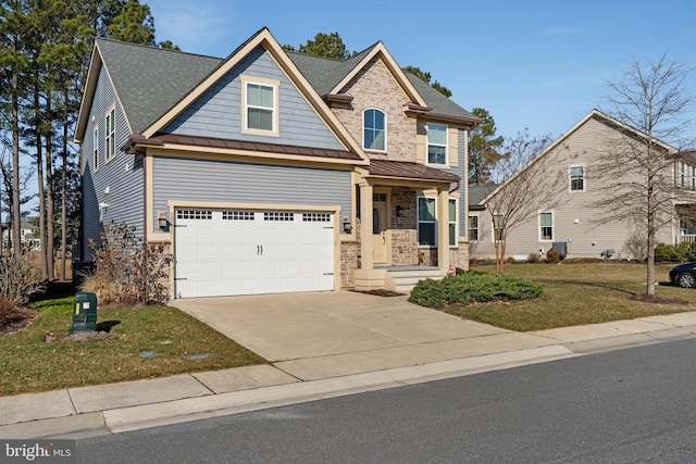 view of front of home with a standing seam roof, concrete driveway, an attached garage, and stone siding