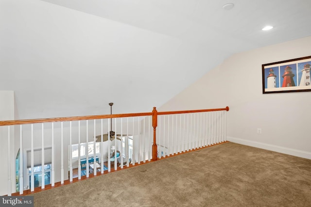 interior space with recessed lighting, baseboards, carpet floors, and lofted ceiling