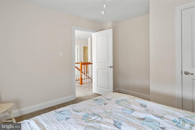 carpeted bedroom with baseboards