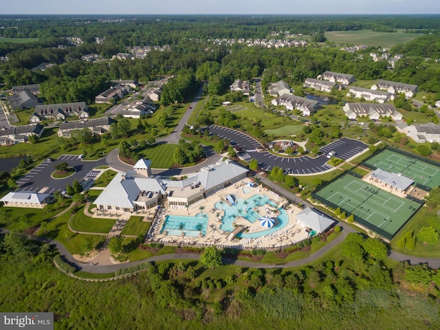 drone / aerial view featuring a forest view