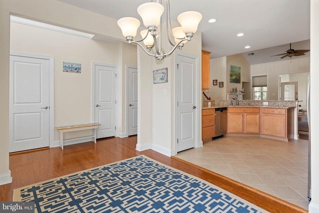 interior space featuring visible vents, baseboards, light wood-type flooring, recessed lighting, and ceiling fan with notable chandelier