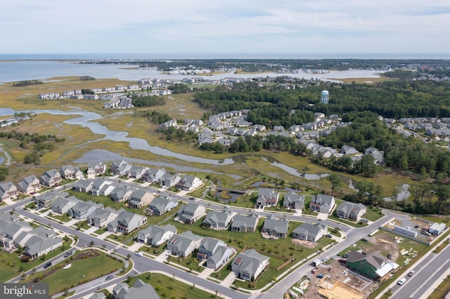 birds eye view of property featuring a residential view and a water view