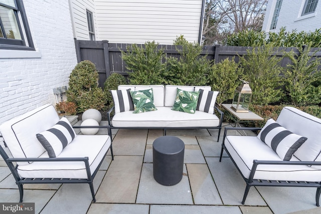 view of patio featuring a fenced backyard and an outdoor living space